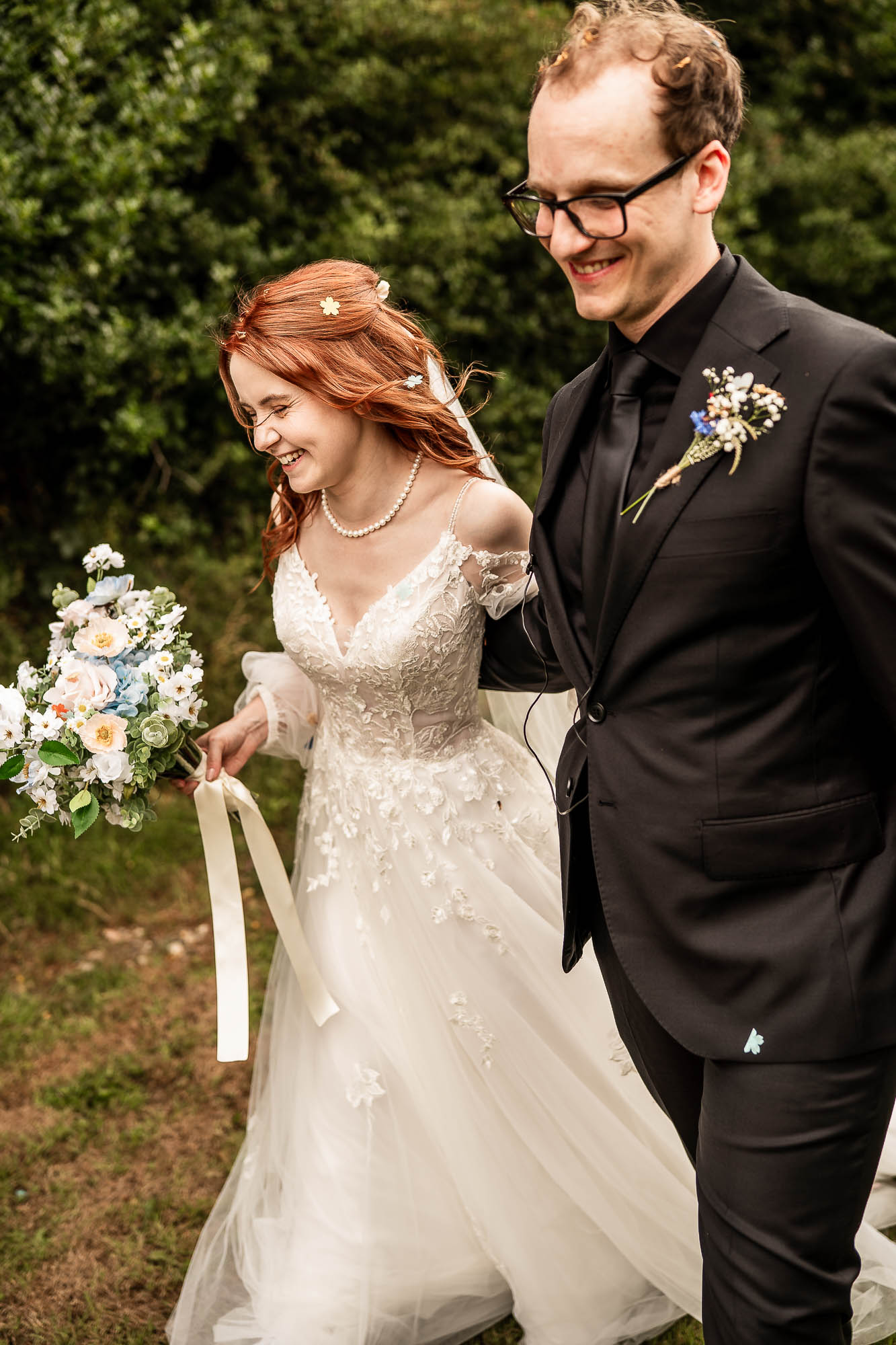 Bride and groom walking together after the wedding ceremony at Wonwood Barton