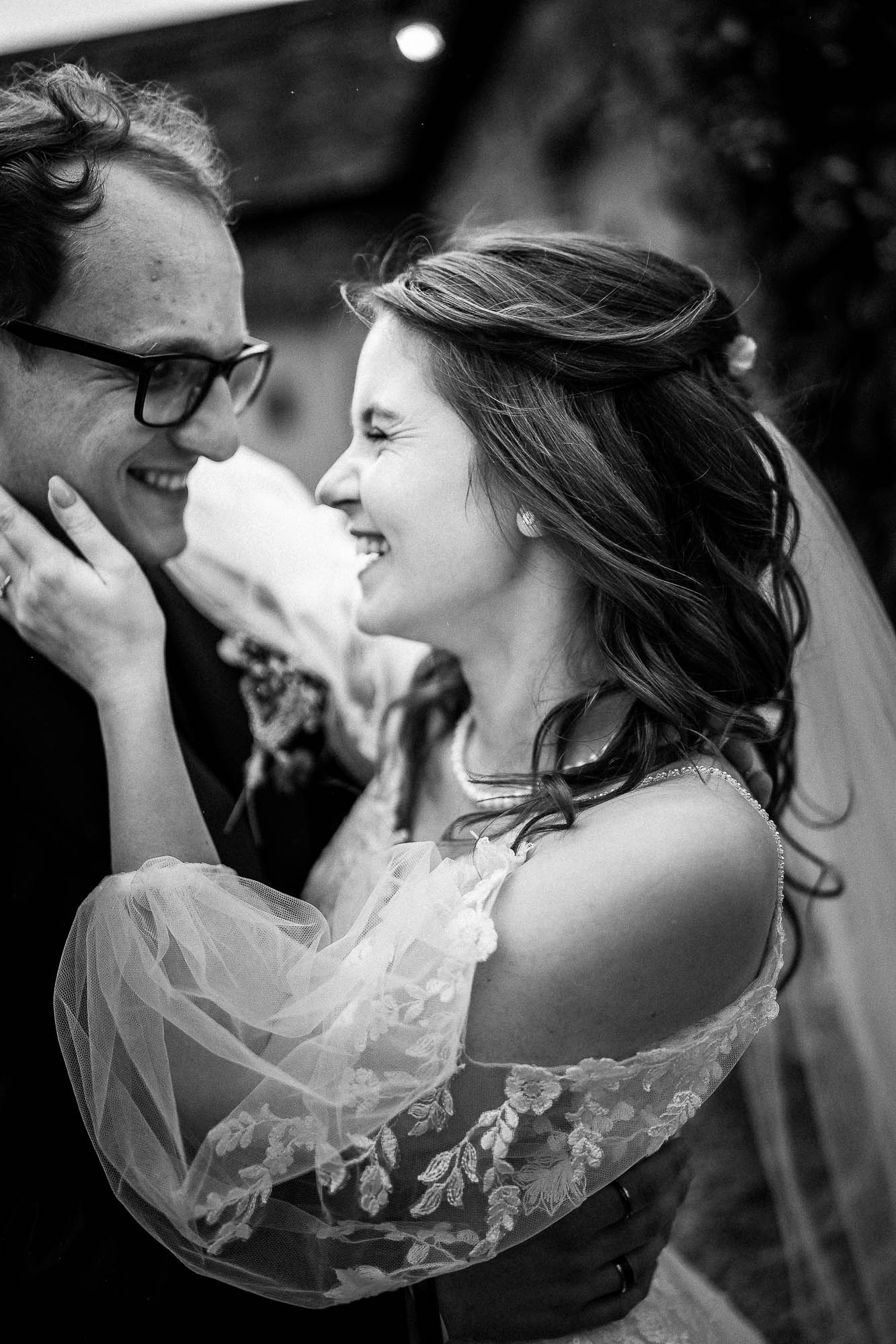 Bride laughing with groom during intimate portrait at Wonwood Barton wedding venue